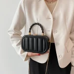 sac bandoulière avec anse en chaîne